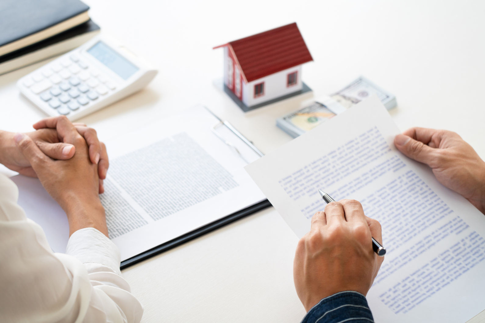 Real Estate Agent Explain Document Agreement  to Home Buyer